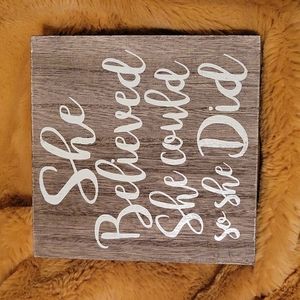 "She believed" sign